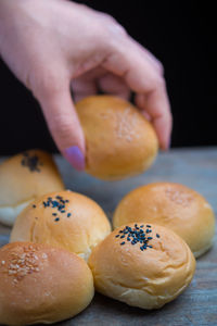 Close-up of hand picking bread