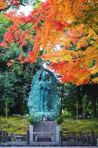 Statue against trees during autumn