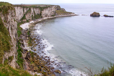 Scenic view of sea coastline against sky in ireland