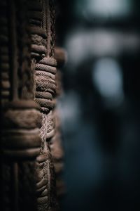 Close-up of rope tied up on wood