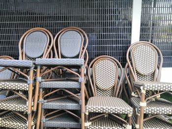 Close-up of empty chairs in rack