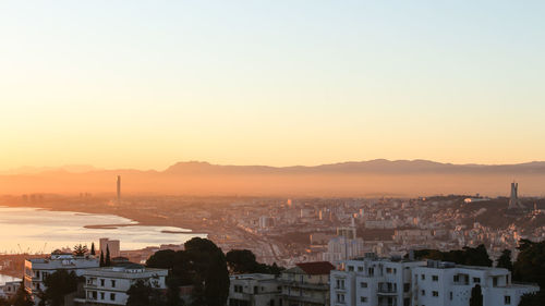 High angle view of city at sunset