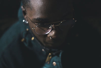 Close-up portrait of young man wearing sunglasses