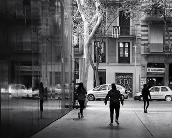 People walking on street in city