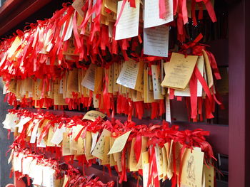 Full frame shot of text hanging outside temple