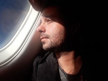 Close-up of passenger sitting in airplane