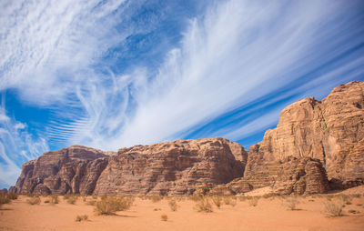 View of rocks against cloudy sky