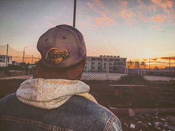 Portrait of man standing against sky during sunset