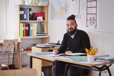 Teacher working in classroom