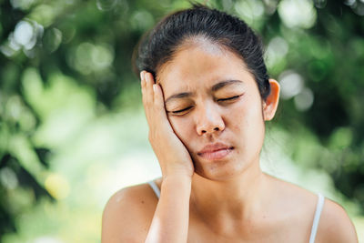 Close-up of woman suffering from toothache