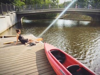 People sitting on boat in river