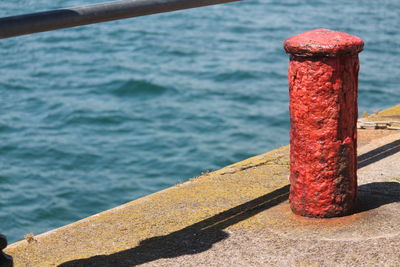 High angle view of railing by sea