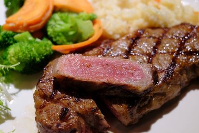 Close-up of meat on barbecue grill