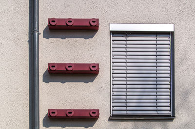 Close-up of bird boxes on wall