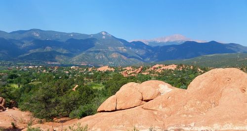 Scenic view of mountains against blue sky