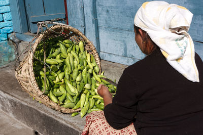 Woman selling vegetables in market