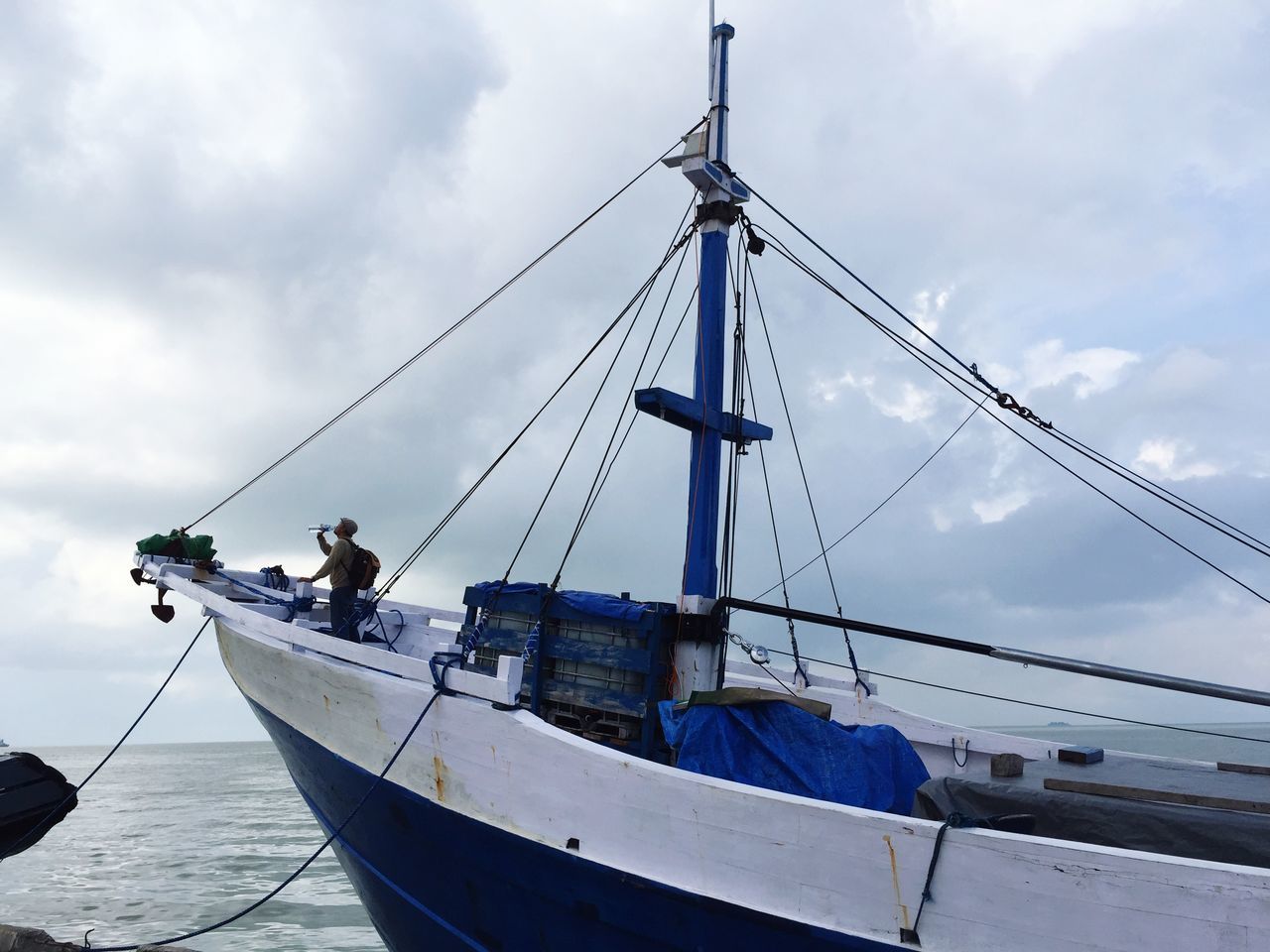 nautical vessel, transportation, mode of transport, boat, sky, mast, water, moored, cloud - sky, sea, sailboat, cloudy, cloud, ship, travel, sailing, day, harbor, nature, waterfront