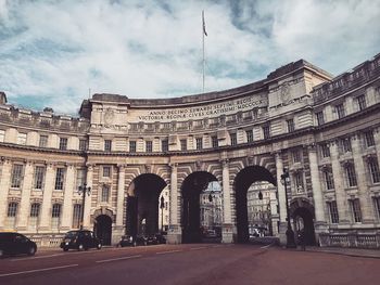 Low angle view of historical building against cloudy sky