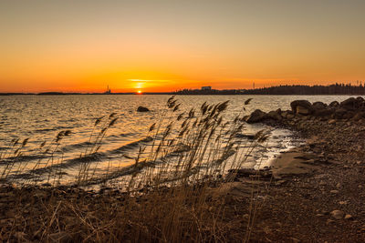 Scenic view of sea against sky during sunset