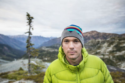 Portrait of confident young man on a hiking trip