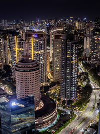 High angle view of illuminated buildings in city at night
