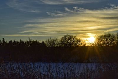 Scenic view of sunset over lake