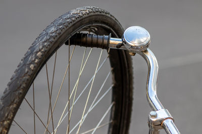 Close-up of wheel on bicycle handle