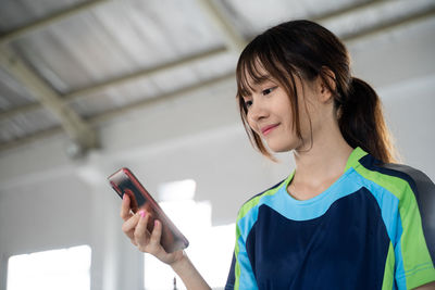 Young woman using mobile phone