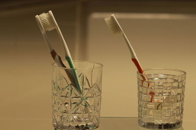 Close-up of glass container on table