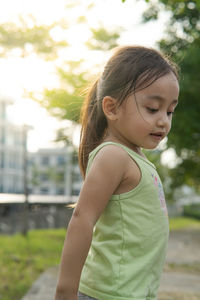 Portrait of a toddler walking outdoor. enjoying nature.