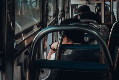 Portrait of woman sitting in train