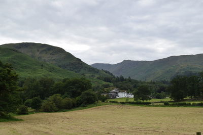 Scenic view of landscape and mountains against sky