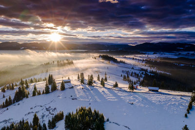 Scenic view of snow covered mountains against sky