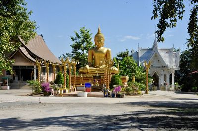 Statue in temple against clear sky