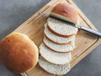 High angle view of bread on cutting board