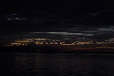 Scenic view of sea against dramatic sky