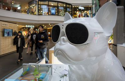 Close-up of people walking in illuminated city