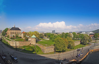 High angle view of city buildings against sky