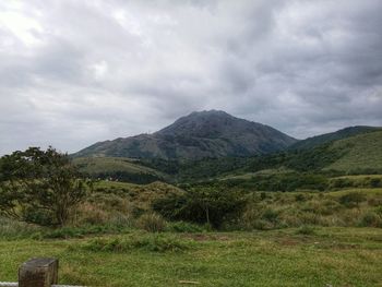 Scenic view of landscape against cloudy sky