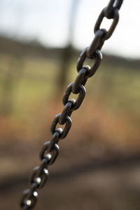Close-up of chain against blurred background