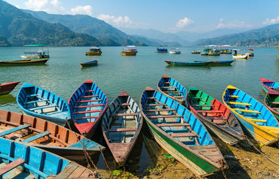 Boats moored in sea