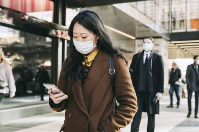 Young woman using mobile phone