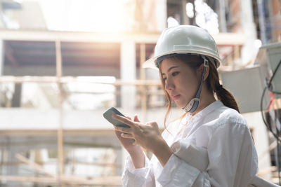 Young woman using mobile phone