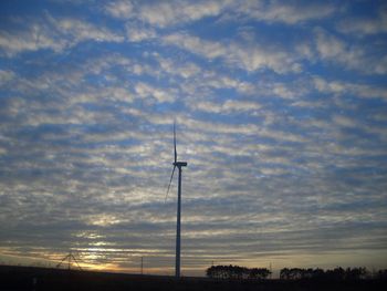 Scenic view of landscape against cloudy sky