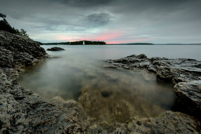 Scenic view of sea against sky during sunset