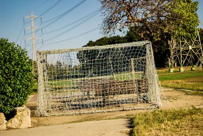 Built structure on field against trees