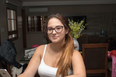 Close-up portrait of beautiful woman at home