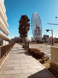 Ferris wheel against sky in city