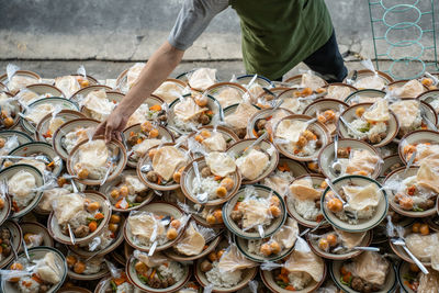 Low section of man preparing food