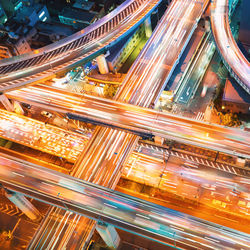 High angle view of light trails on multiple lane highway in city